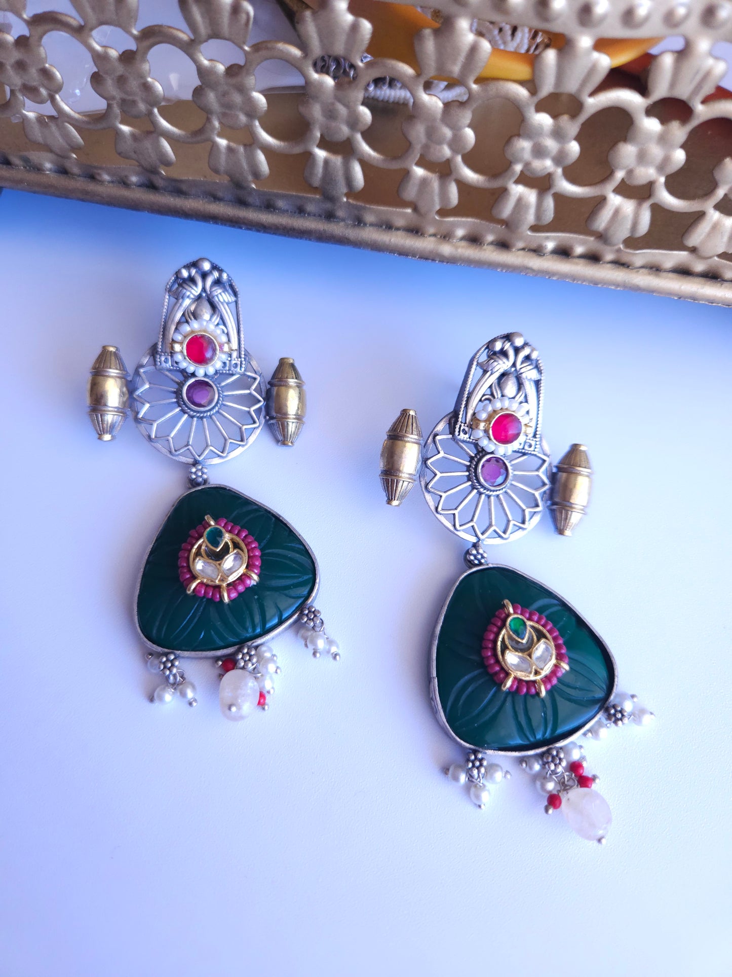 Anugna kemp silver alike earrings