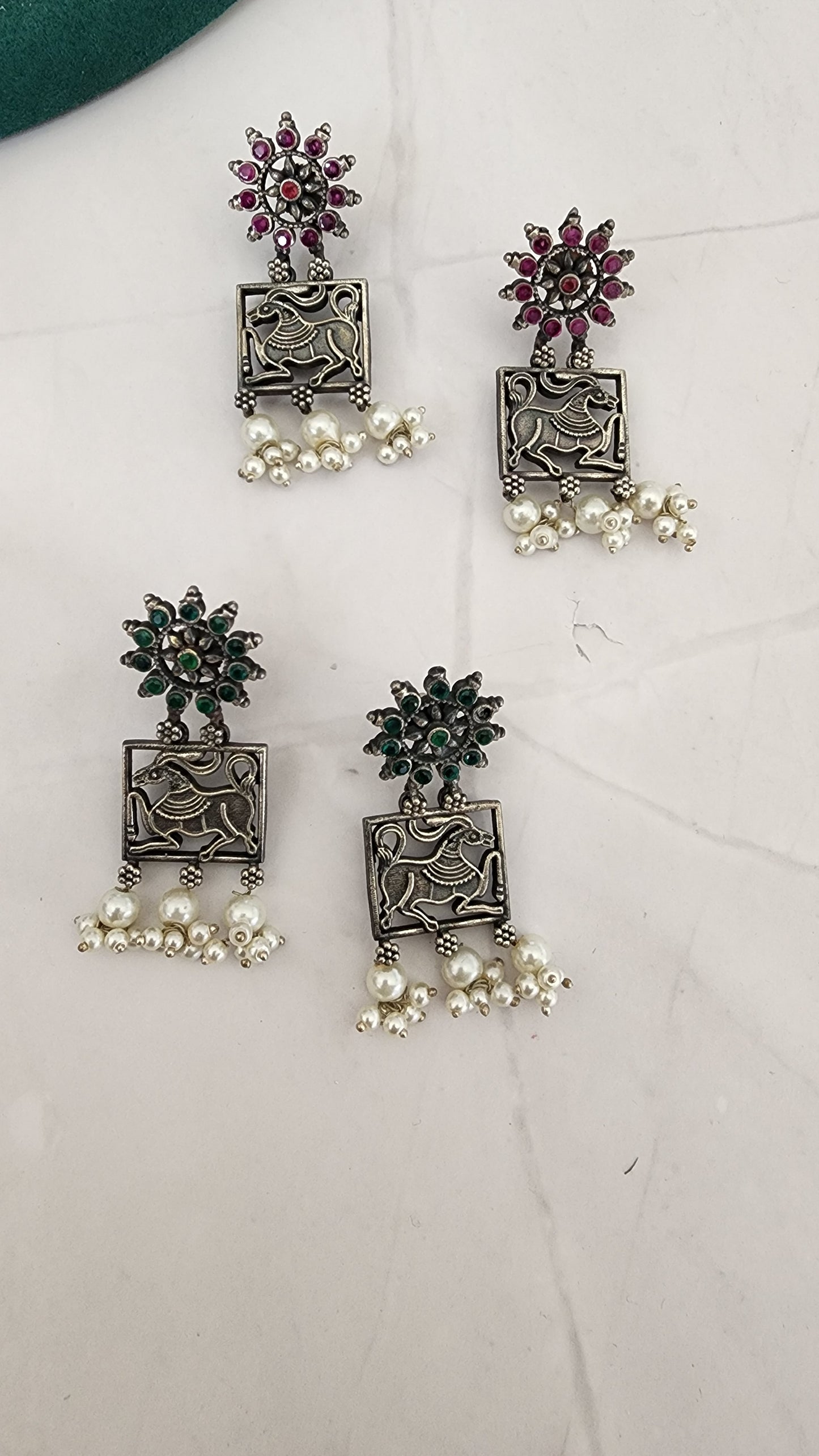 Poorvi silver alike earrings