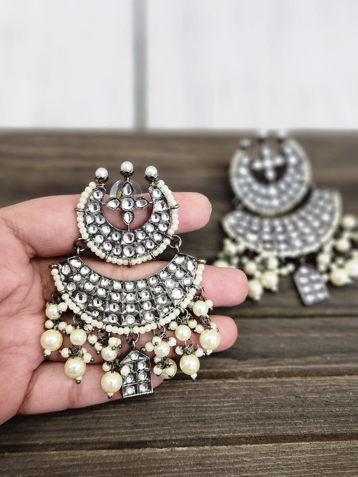 Black rodium plated jhumka earrings