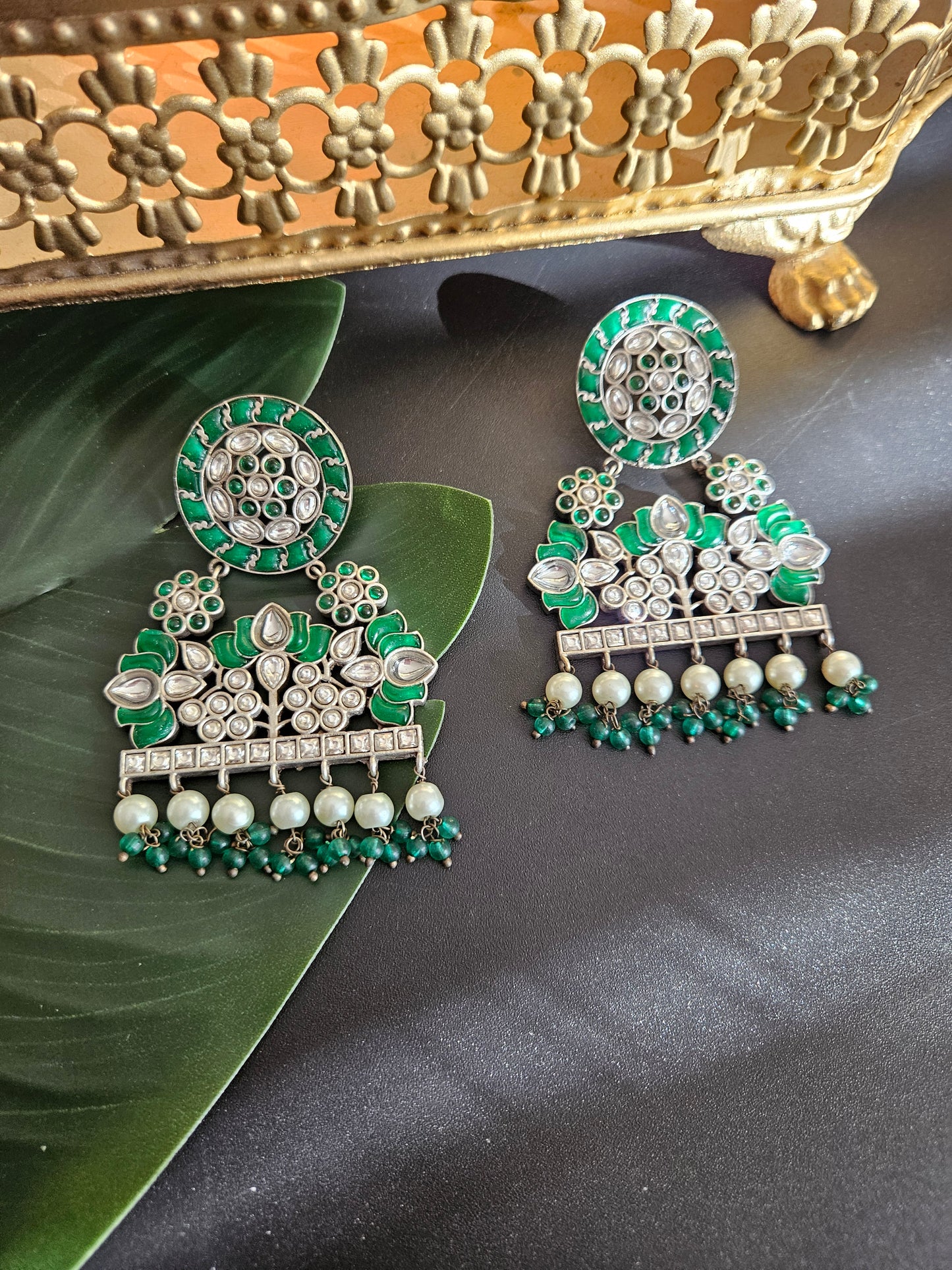 Anugna kemp silver alike earrings