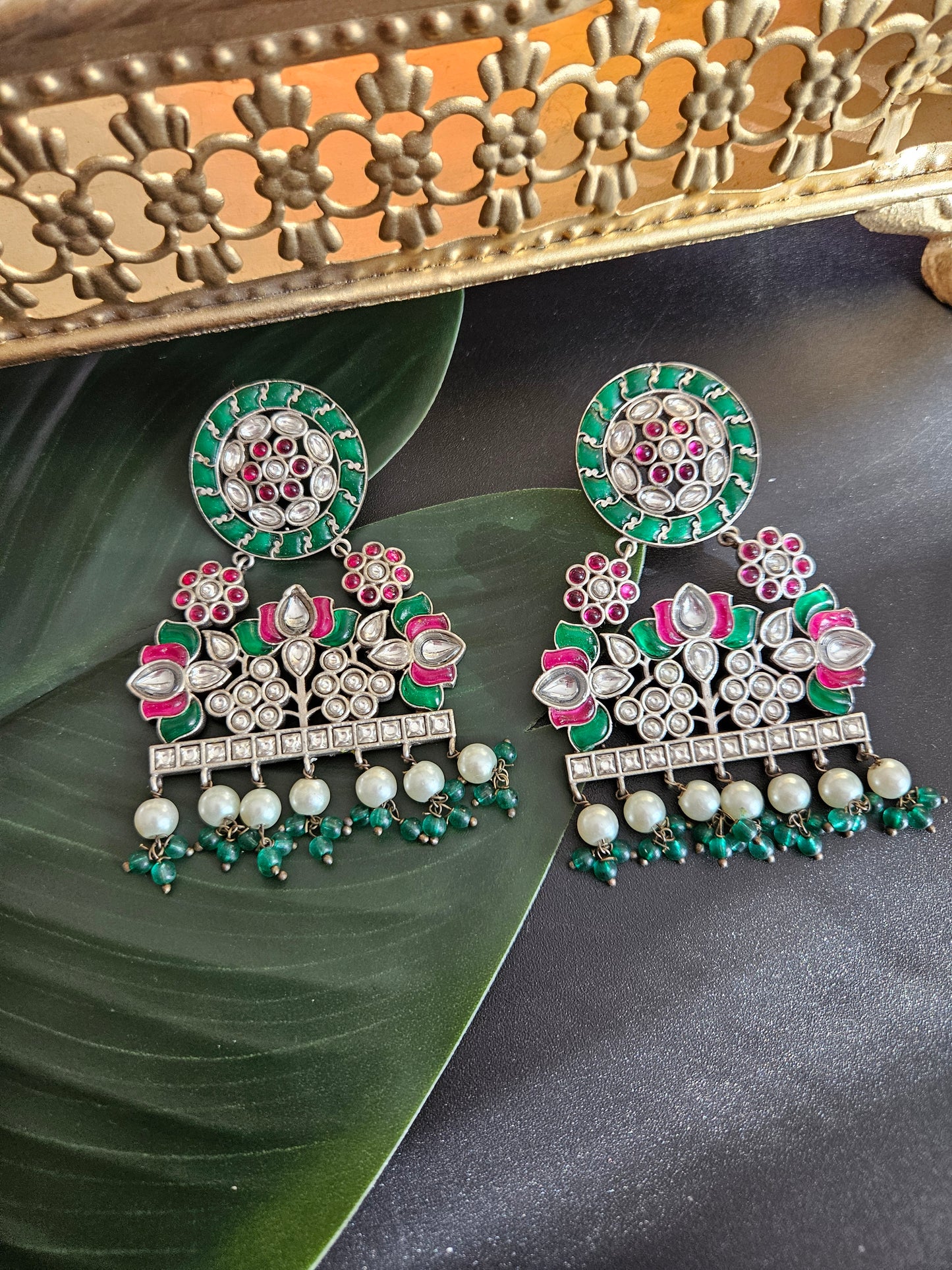 Anugna kemp silver alike earrings