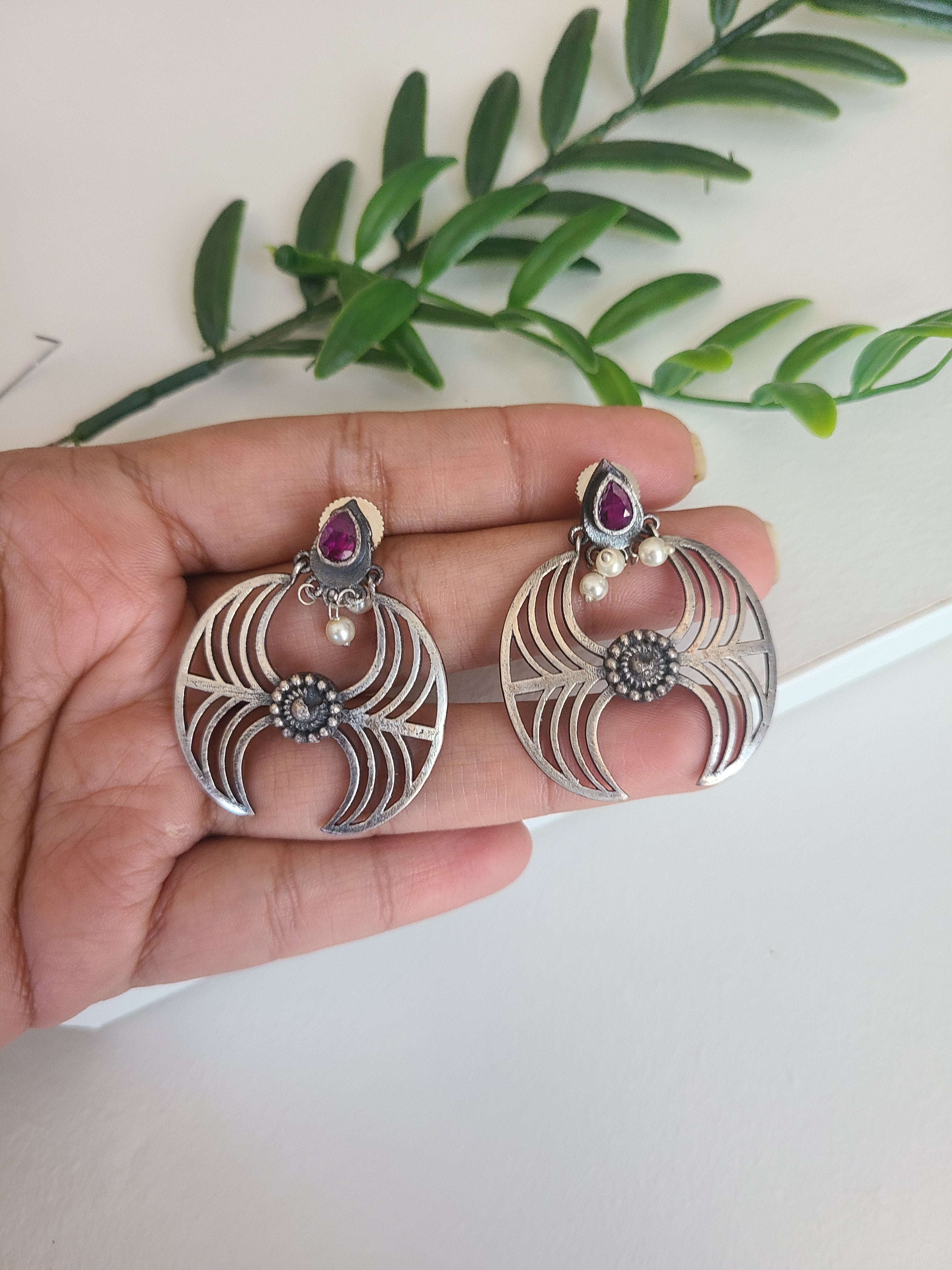 Unique silver alike earrings