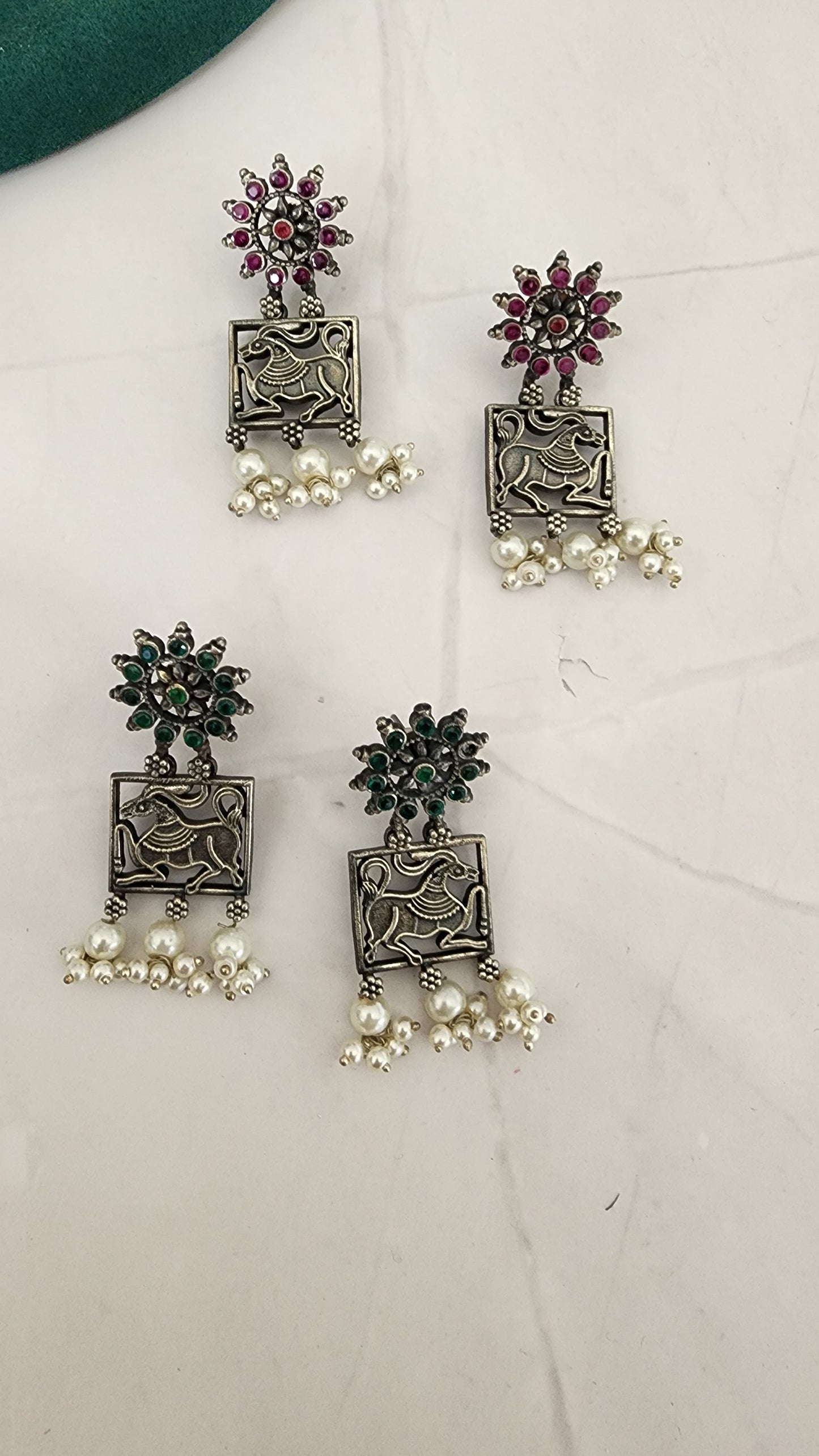 Poorvi silver alike earrings