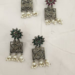 Poorvi silver alike earrings