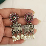 Poorvi silver alike earrings