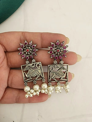 Poorvi silver alike earrings
