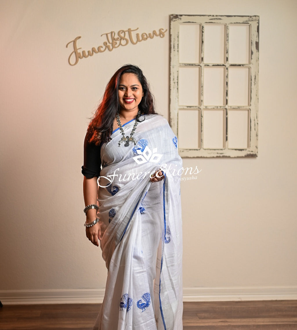 Pure Linen White saree with Zari border and embroidered Peacocks saree